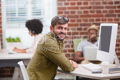 Portrait of casual young man using computer Portrait of casual young man using computer