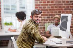 Portrait of casual young man using computer