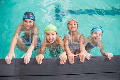 Cute swimming class in the pool