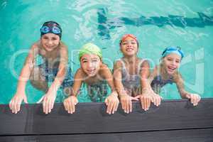 Cute swimming class in the pool