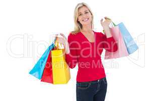 Happy blonde holding shopping bags