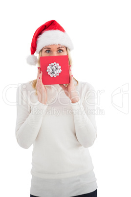 Festive blonde showing christmas gift