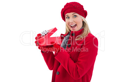 Festive blonde holding red gift