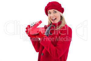 Festive blonde holding red gift