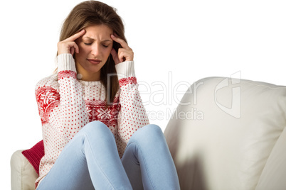 Young woman with a headache rubbing her head