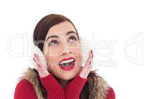 Surprised brunette in winter clothes
