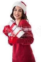 Cheerful brunette holding christmas presents