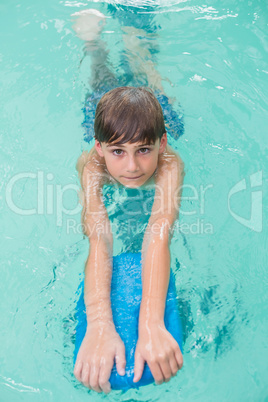 Cute little boy learning to swim