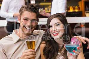 Happy couple having a drink together