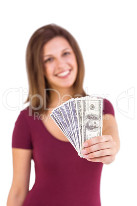 Festive brunette in dress showing her cash