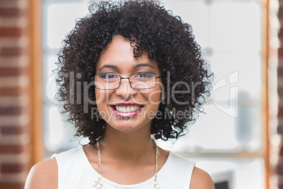 Smiling young businesswoman in office