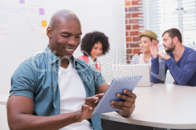 Man using digital tablet in business meeting