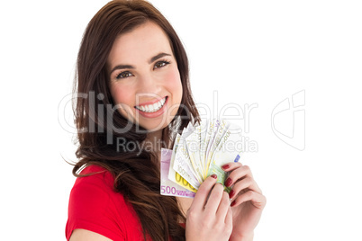 Happy brunette holding her cash money