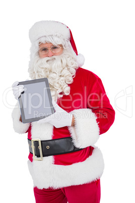 Happy santa showing digital tablet