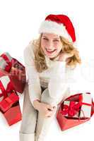 Smiling woman sitting on floor with shopping bag