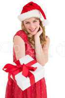 Cute woman in red dress offering gift