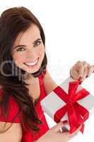 Smiling brunette opening gift