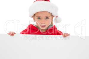 Festive little girl showing poster