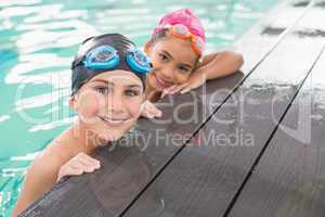 Cute swimming class in the pool