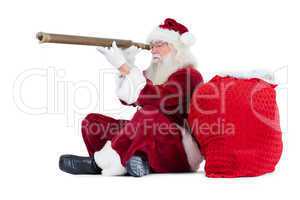 Santa is looking through his telescope