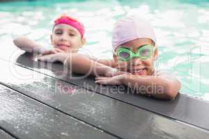 Cute little girls in the swimming pool