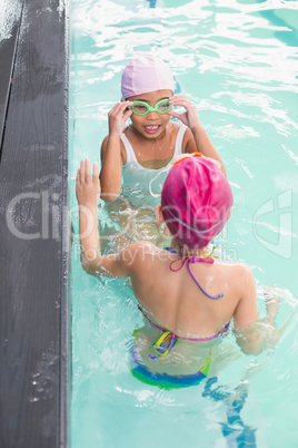 Cute little girls in the swimming pool