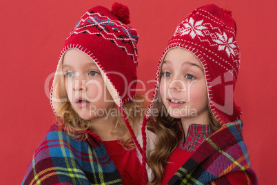 Festive little girls under a blanket