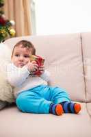 Cute baby boy on the couch at christmas