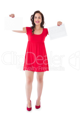 Stylish brunette in red dress holding pages