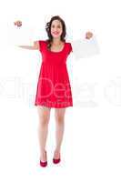 Stylish brunette in red dress holding pages