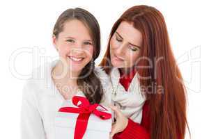 Mother and daughter with christmas gift