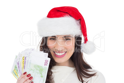 Happy brunette holding her cash