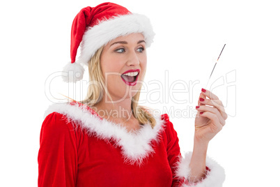 Festive blonde smiling at hand