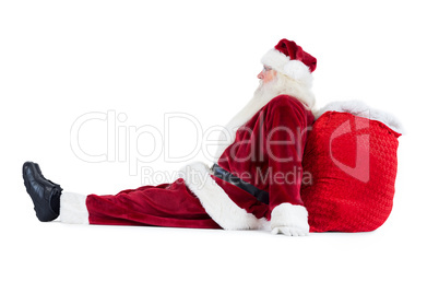 Santa sits leaned on his bag