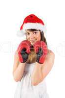 Festive brunette with boxing gloves