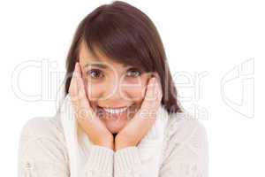 Brunette in winter clothes smiling at camera