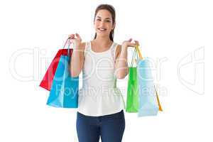 Cheerful brown hair holding shopping bags
