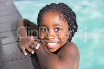 Cute little girl swimming in the pool