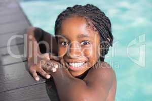 Cute little girl swimming in the pool