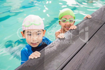 Cute swimming class in the pool