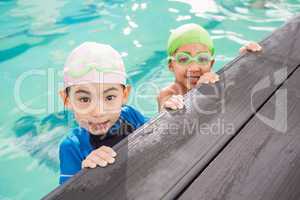 Cute swimming class in the pool