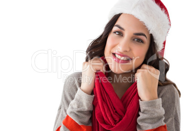 Happy brunette in winter clothes smiling at camera