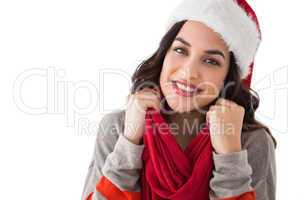 Happy brunette in winter clothes smiling at camera