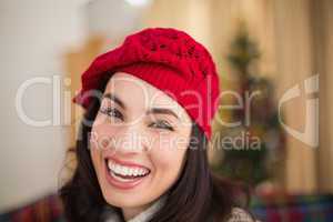 Portrait of a brunette in hat at christmas