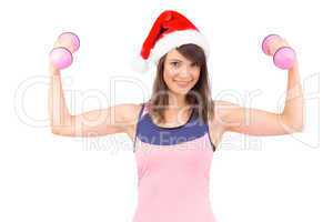 Woman in santa hat holding hand weight