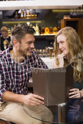 Young couple discussing the menu