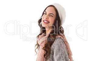 Brunette in winter clothes winking her eye