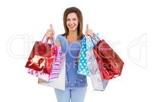 Woman showing shopping bags with the thumbs up