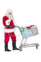 Positive santa delivering gifts with a trolley