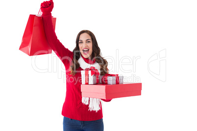 Excited brunette showing christmas gifts